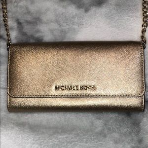 Gold Michael Kors purse.